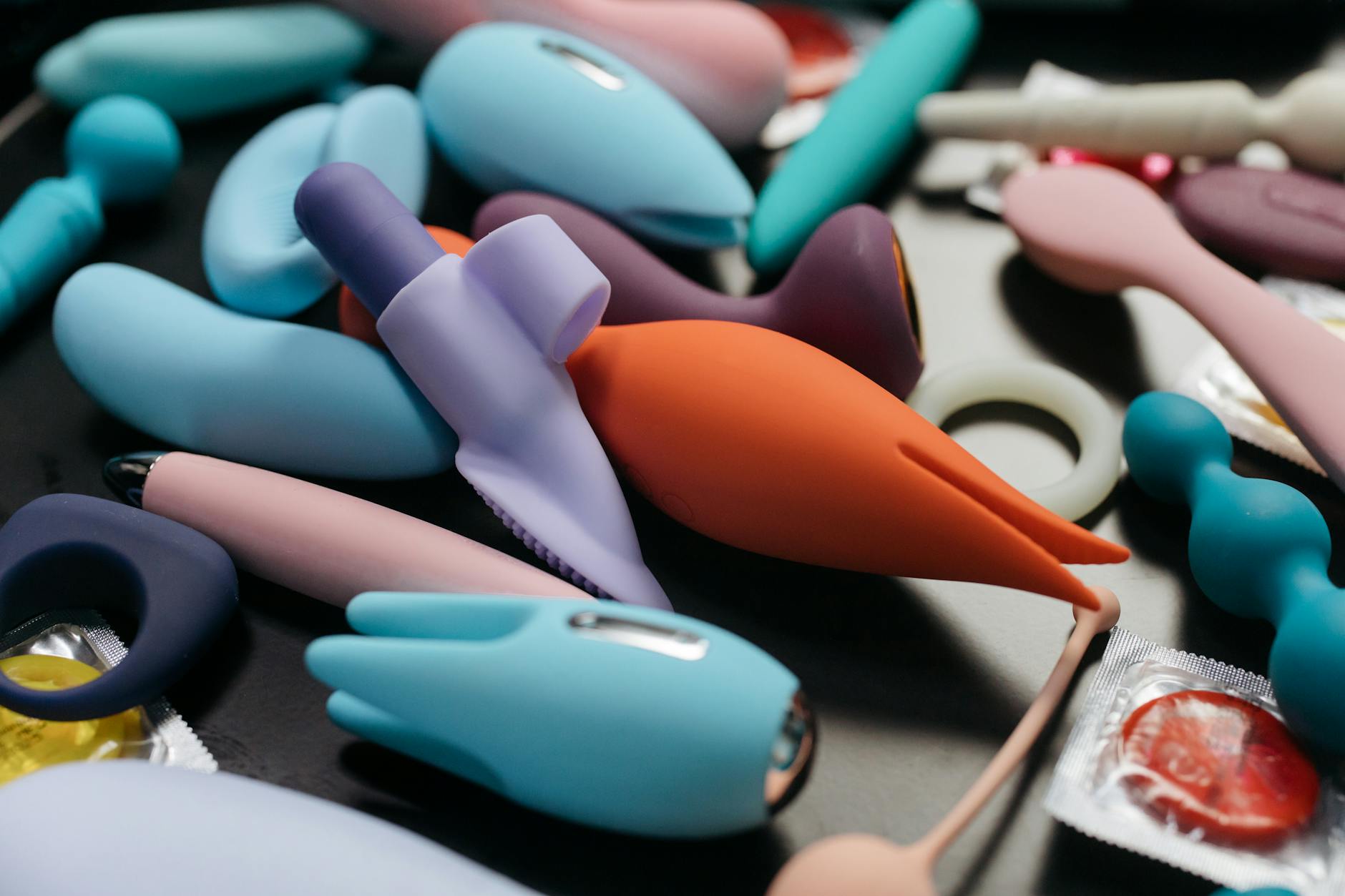 An array of vibrant personal massagers and intimate toys in a close-up view